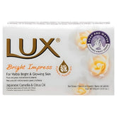 Front view of Lux - Bright Impress Soap - 80g box, with Japanese Camellia and Citrus Oil. Features floral graphics and bilingual (English/French) product details for a radiant complexion.